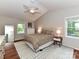 Bedroom featuring a patterned bedspread, ceiling fan, hardwood floors, and natural light at 5043 Hickory Lake Ln, Matthews, NC 28105