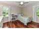 Bedroom featuring hardwood floors, natural light and a ceiling fan at 5043 Hickory Lake Ln, Matthews, NC 28105
