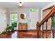 Bright foyer with hardwood floors, fresh paint, and large window at 5043 Hickory Lake Ln, Matthews, NC 28105