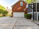 Spacious garage with a basketball hoop for recreational fun on the driveway at 5043 Hickory Lake Ln, Matthews, NC 28105