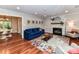 Cozy living room with hardwood floors, fireplace, and a comfortable seating area at 5043 Hickory Lake Ln, Matthews, NC 28105