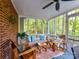 Relaxing sunroom with comfortable furniture, natural light and outdoor view at 5043 Hickory Lake Ln, Matthews, NC 28105