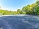 Well-maintained tennis court for active recreation and enjoyment on a sunny day at 5043 Hickory Lake Ln, Matthews, NC 28105