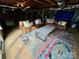 Finished basement featuring leather sofas, a modern coffee table, and a colorful area rug at 5373 Nc Hwy 16 N Hwy, Taylorsville, NC 28681