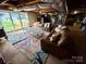 Spacious basement featuring exposed ceiling, sliding doors, and modern furniture on a colorful area rug at 5373 Nc Hwy 16 N Hwy, Taylorsville, NC 28681