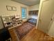 Inviting bedroom with hardwood floors, ample storage, and a cozy area for reading and playing at 5373 Nc Hwy 16 N Hwy, Taylorsville, NC 28681