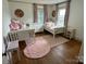 Charming bedroom with two beds, pink accents, and ample natural light is bright and cheerful at 5373 Nc Hwy 16 N Hwy, Taylorsville, NC 28681