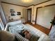 This bedroom features a soothing green color palette, hardwood floors, and built-in shelving at 5373 Nc Hwy 16 N Hwy, Taylorsville, NC 28681