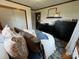 Well-lit bedroom features charming décor and a comfortable bed for relaxing and unwinding in the home at 5373 Nc Hwy 16 N Hwy, Taylorsville, NC 28681