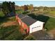 Exterior shot highlighting the brick, attached garage, and solar panels of this property at 5373 Nc Hwy 16 N Hwy, Taylorsville, NC 28681