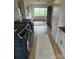 A practical laundry room featuring modern machines, ample storage, and an open view to the outdoors at 5373 Nc Hwy 16 N Hwy, Taylorsville, NC 28681