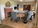 Comfortable living room featuring a fireplace, ample seating, and a view into dining and living area at 5373 Nc Hwy 16 N Hwy, Taylorsville, NC 28681