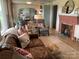 Living room with fireplace, sofa, chairs, decor, view to kitchen, and lots of natural light at 5373 Nc Hwy 16 N Hwy, Taylorsville, NC 28681
