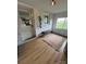 Bright mudroom featuring white brick walls, a charming bench, decorative rug, and a view to the outdoors at 5373 Nc Hwy 16 N Hwy, Taylorsville, NC 28681