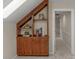 Cozy attic space with built-in wooden shelves and cabinets, perfect for storage and decor at 5750 Hemby Rd, Matthews, NC 28104