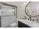 Modern bathroom features a glass-enclosed shower, black fixtures, and a contemporary vanity at 5750 Hemby Rd, Matthews, NC 28104
