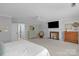 Spacious bedroom with a fireplace, large windows, and a ceiling fan at 5750 Hemby Rd, Matthews, NC 28104
