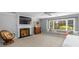 Bright bedroom featuring a fireplace, a cozy window seat, and a neutral color palette at 5750 Hemby Rd, Matthews, NC 28104