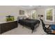 Well-lit bedroom with a large window, neutral walls, and modern finishes at 5750 Hemby Rd, Matthews, NC 28104