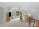 Bonus room with ample natural light, a comfortable seating area, and a ceiling fan at 5750 Hemby Rd, Matthews, NC 28104