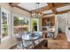 Sunny breakfast nook features a large window, and a table with bench seating at 5750 Hemby Rd, Matthews, NC 28104