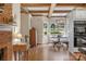 Bright dining area features hardwood floors, wood-beamed ceilings, and a view of the backyard at 5750 Hemby Rd, Matthews, NC 28104