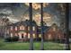 Charming brick two-story home with manicured lawn, elegant entryway, and inviting curb appeal at 5750 Hemby Rd, Matthews, NC 28104