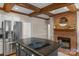Kitchen with stainless steel appliances, granite countertops, kitchen island and brick fireplace at 5750 Hemby Rd, Matthews, NC 28104