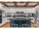 Modern kitchen with white cabinets, granite countertops, stainless steel appliances and wood-beamed ceilings at 5750 Hemby Rd, Matthews, NC 28104