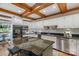 Modern kitchen with white cabinets, granite countertops, stainless steel appliances and wood-beamed ceilings at 5750 Hemby Rd, Matthews, NC 28104