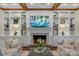 Bright living room with custom built-ins, coffered ceilings and cozy fireplace at 5750 Hemby Rd, Matthews, NC 28104