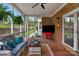 Inviting screened porch featuring comfortable seating, brick floors, and garden views at 5750 Hemby Rd, Matthews, NC 28104