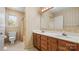 Bathroom featuring a double sink vanity and full bathtub/shower at 600 Community Ln, Lancaster, SC 29720