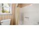 Neutral bathroom featuring shower and window at 600 Community Ln, Lancaster, SC 29720