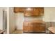 Eat-in kitchen features wood cabinets, countertops, and neutral walls and flooring at 600 Community Ln, Lancaster, SC 29720