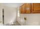 Laundry room with storage cabinets and access to the outside at 600 Community Ln, Lancaster, SC 29720