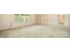Expansive living room featuring neutral walls, dated carpeting, and multiple doorways for easy flow at 600 Community Ln, Lancaster, SC 29720