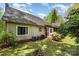 Backyard featuring a screened porch, mature trees, and a well-maintained lawn at 608 Grace St, Shelby, NC 28150