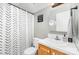 Bathroom with white vanity, toilet and patterned shower curtain at 608 Grace St, Shelby, NC 28150