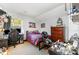 Attic bedroom with desk, dark gaming chair, and assorted gamer décor at 608 Grace St, Shelby, NC 28150