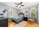 Well-lit bedroom featuring neutral decor, hardwood floors, and stylish furnishings at 608 Grace St, Shelby, NC 28150
