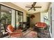 Cozy covered porch featuring comfortable seating, ceiling fan, and outdoor grill at 608 Grace St, Shelby, NC 28150