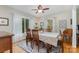 Bright dining room featuring a wood dining table, with hardwood floors, and large windows at 608 Grace St, Shelby, NC 28150