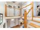 Bright entryway featuring an open staircase with wood and white banisters and a decorative hanging light at 608 Grace St, Shelby, NC 28150