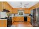 Traditional kitchen featuring stainless steel refrigerator, gas cooktop, and light wood cabinetry at 608 Grace St, Shelby, NC 28150