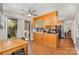 Eat-in kitchen featuring light wood cabinets, stainless steel appliances, and access to the patio at 608 Grace St, Shelby, NC 28150