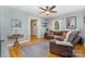 Cozy living room featuring hardwood floors, neutral paint, ceiling fan and comfortable seating at 608 Grace St, Shelby, NC 28150