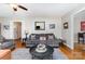 Comfortable living room with hardwood floors, a ceiling fan, and an area rug to highlight the space at 608 Grace St, Shelby, NC 28150