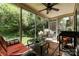 Relaxing screened porch with comfortable seating area, coffee table, and view of landscaped yard at 608 Grace St, Shelby, NC 28150