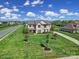Expansive front yard with mature trees, enhancing the curb appeal of this beautifully landscaped home at 610 Blaise Ct, Matthews, NC 28104